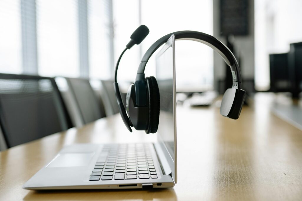 A headset and laptop ready for the ManageEngine webinar.